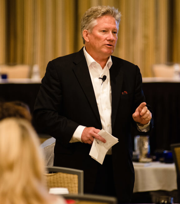 Chris McGoff Speaking In Front of Audience